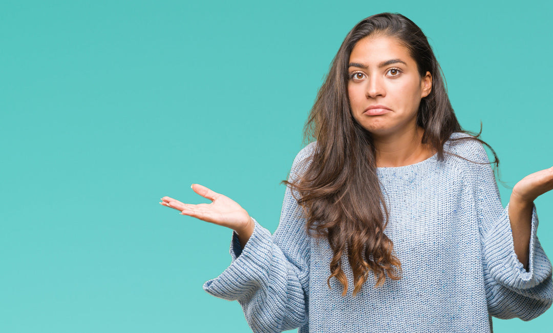 Woman with hands aloft asking question